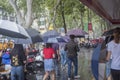 ItÃ¢â¬â¢s raining in the morning, and pedestrians walking through the road pass by the intersection.